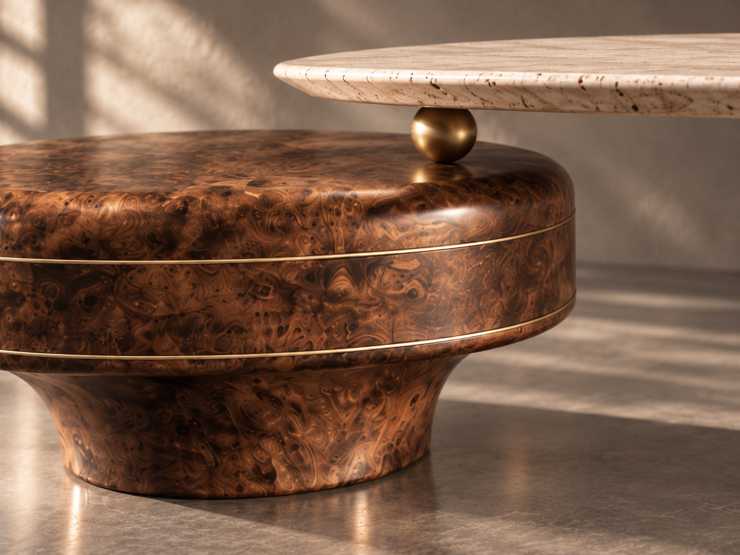 Burl wood, brass inlays and a travertine surface in a sculptural furniture detail